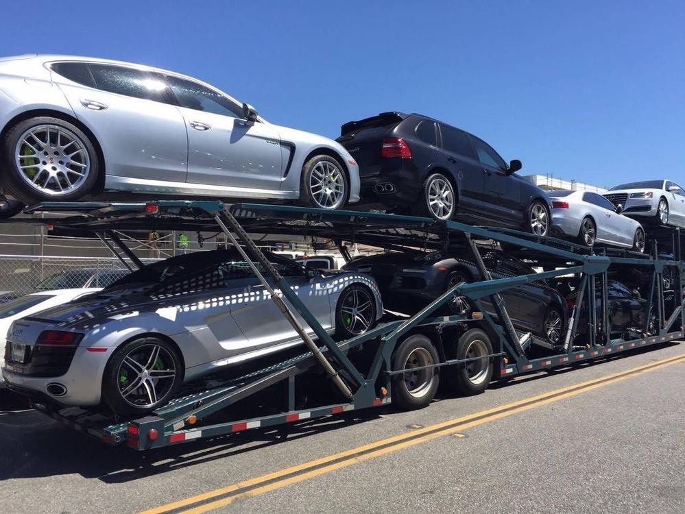 Open carrier loaded with sports cars coordinated by Edgebay